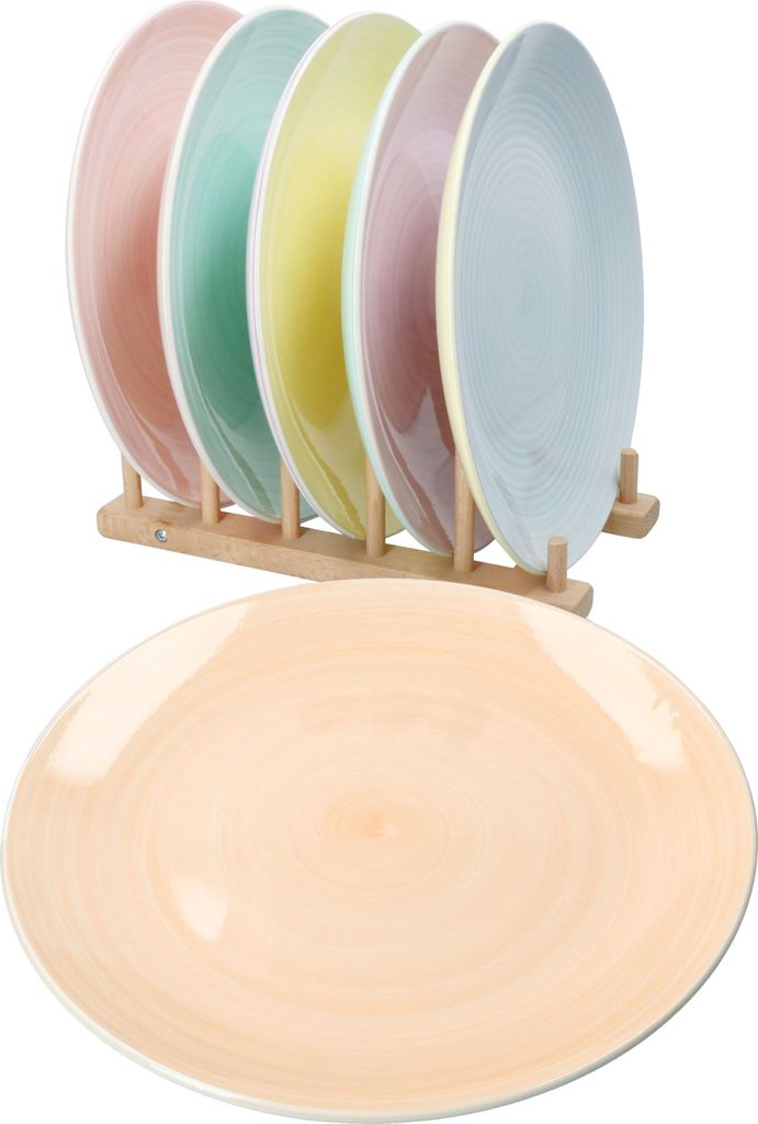 A set of colorful plates displayed on a wooden stand, with one plate in the foreground.
