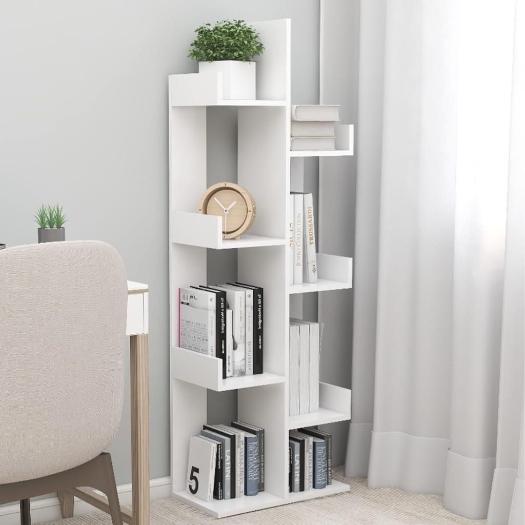 A white bookshelf with books and a plant.