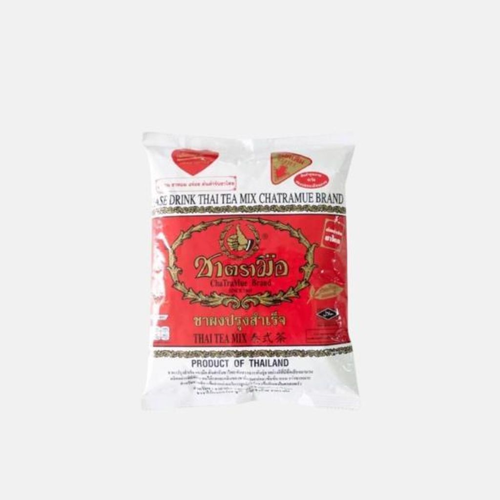 A bag of Thai tea mix on a plain background.