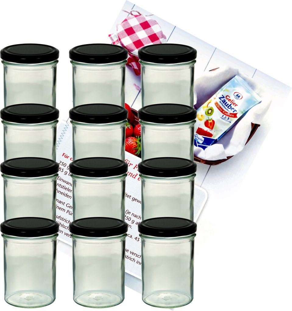 A set of glass jars with black lids, arranged in rows, with a recipe booklet and a packet of jelly powder in the background.