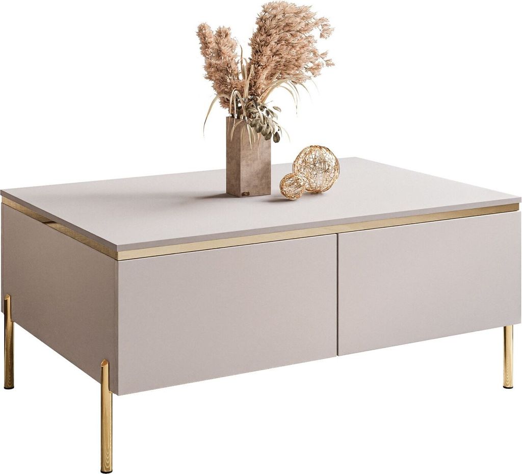 A modern coffee table with gold legs and decorative items on top.