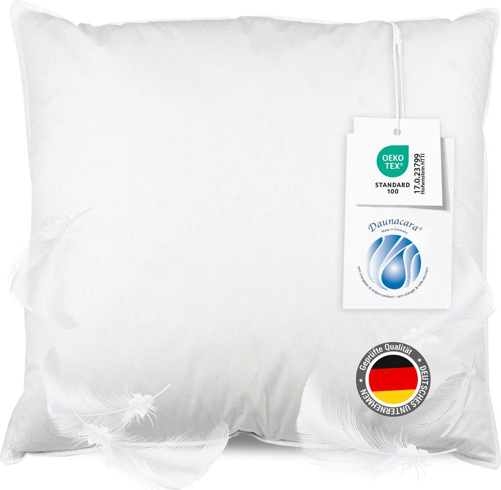 A white pillow with feathers and product tags.