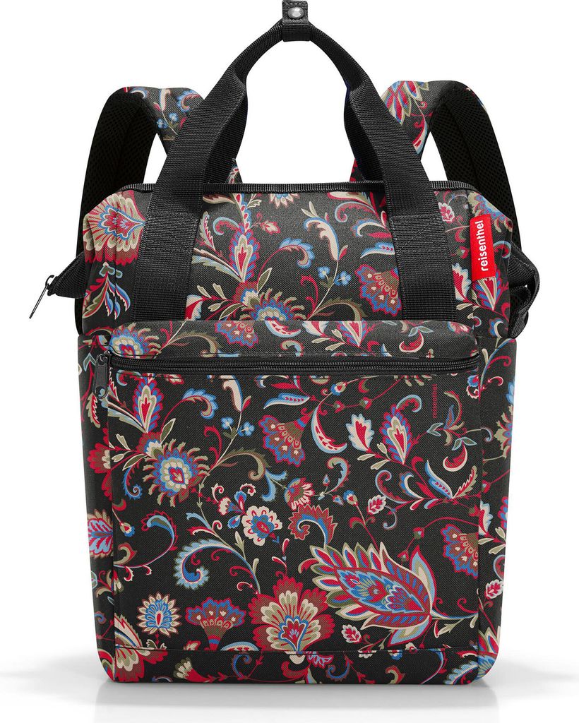 A black backpack with a colorful floral paisley pattern.