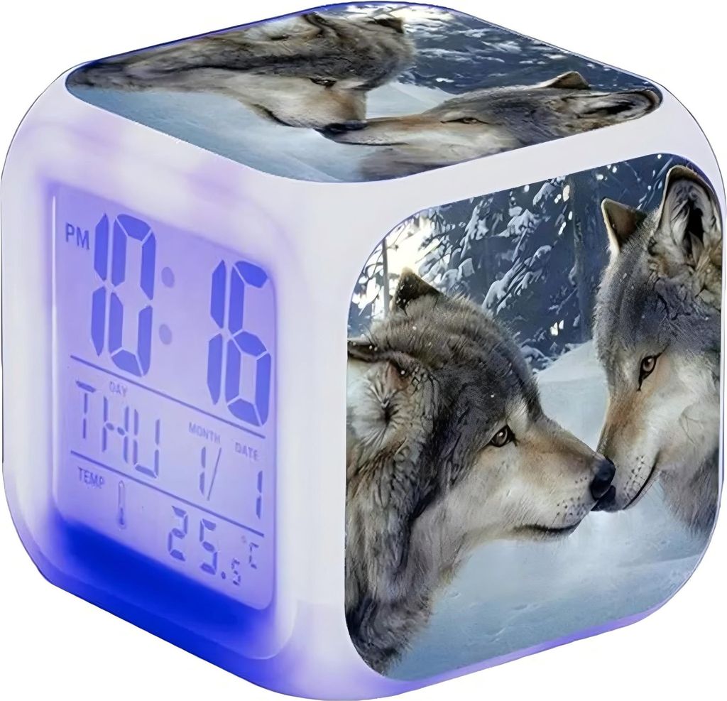 A digital alarm clock with a wolf motif, displaying the time, day, month, date, and temperature. The clock is illuminated with blue light at the bottom.