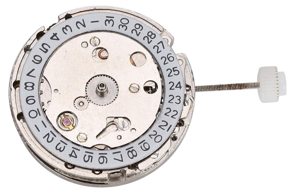 A close-up view of a watch movement with a date complication.