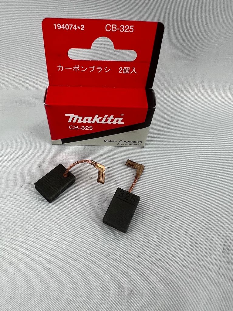 A product shot of Makita carbon brushes and their packaging.