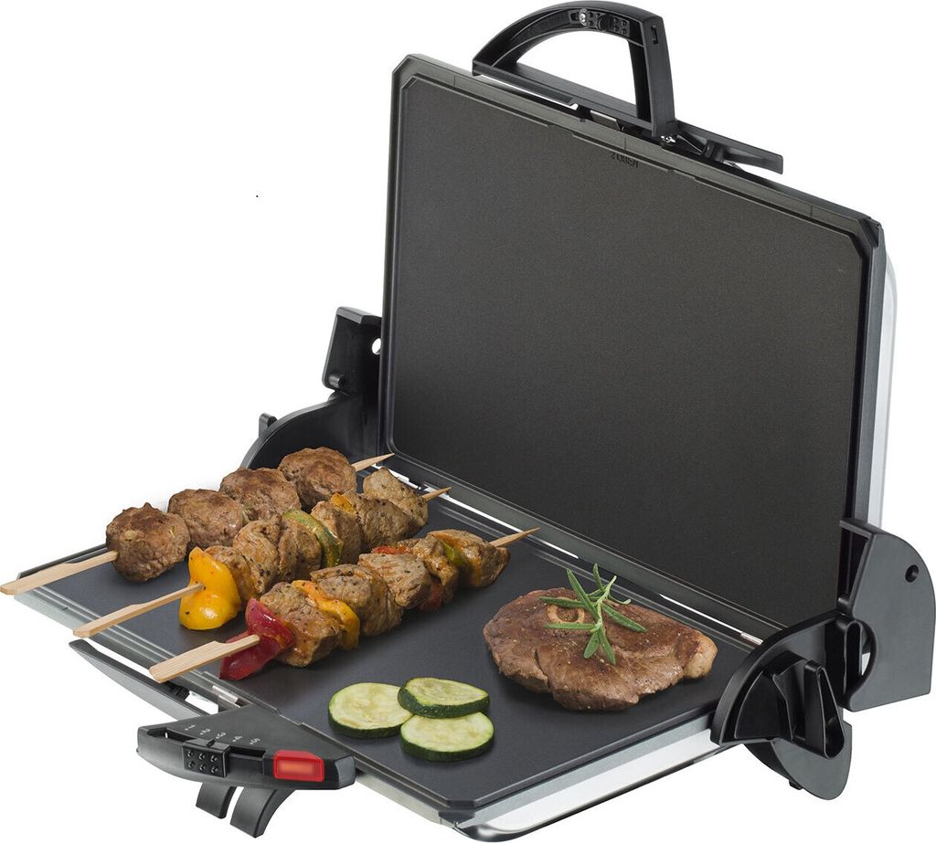 An open electric grill with food cooking on it.
