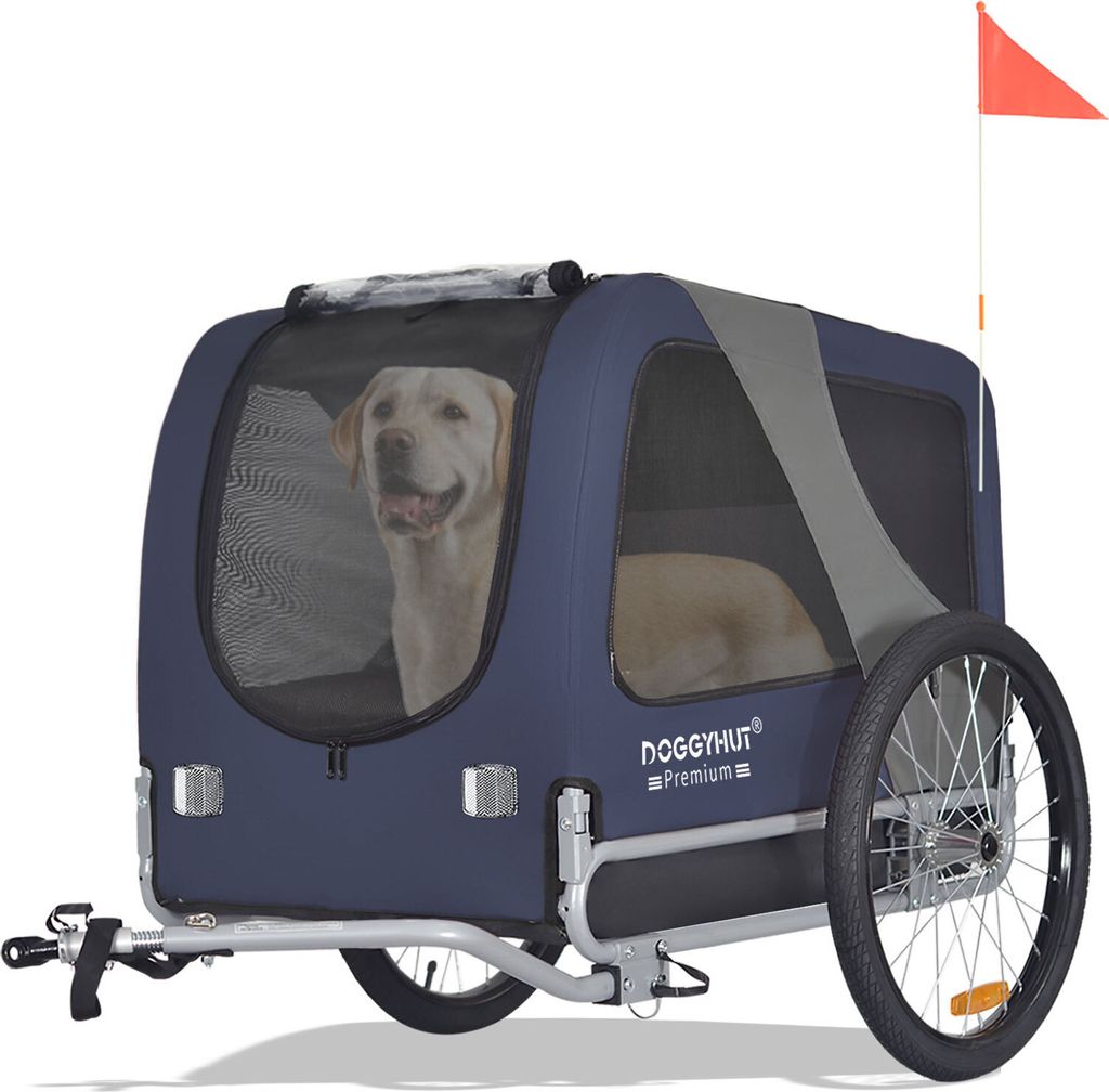 A dog is inside a blue and gray dog trailer for bicycles.