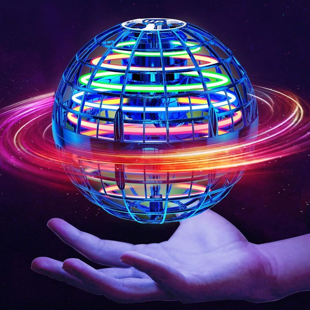 A glowing, spherical toy drone is hovering above an open hand, with colorful light trails swirling around it.