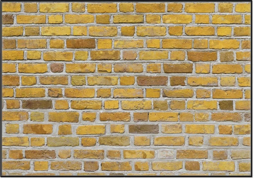 Wallario Wandbild Ziegelsteinwand in gelb - Backsteine, Größe: 70,30 x 100,30 cm, Poster mit schwarzem Aluminiumrahmen