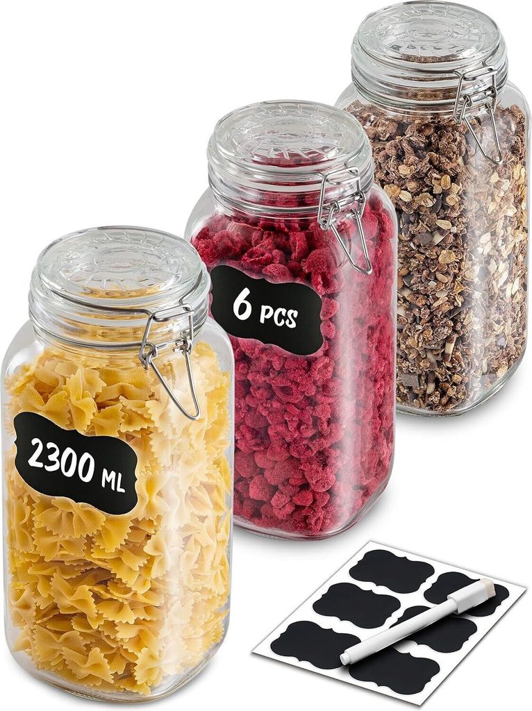 Three glass jars filled with food items, with labels and a pen on a white background.