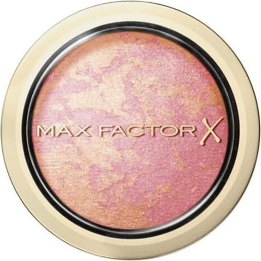 A close-up, top-down view of a round makeup compact with a gold-colored rim and a marbled pink and gold powder inside.