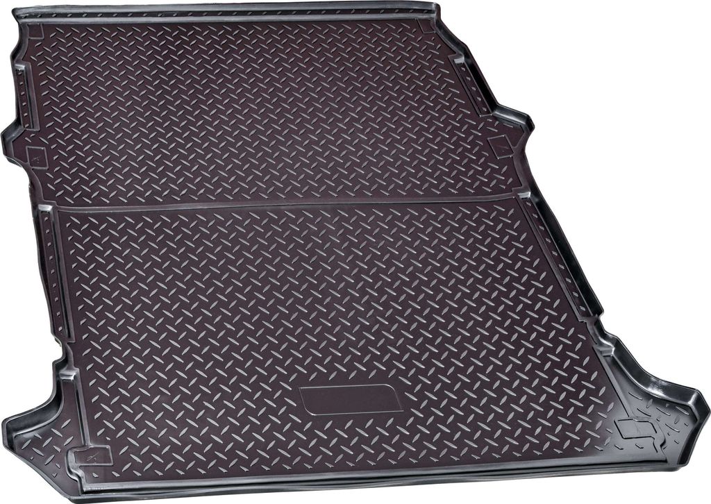 A car trunk liner with a diamond plate pattern.
