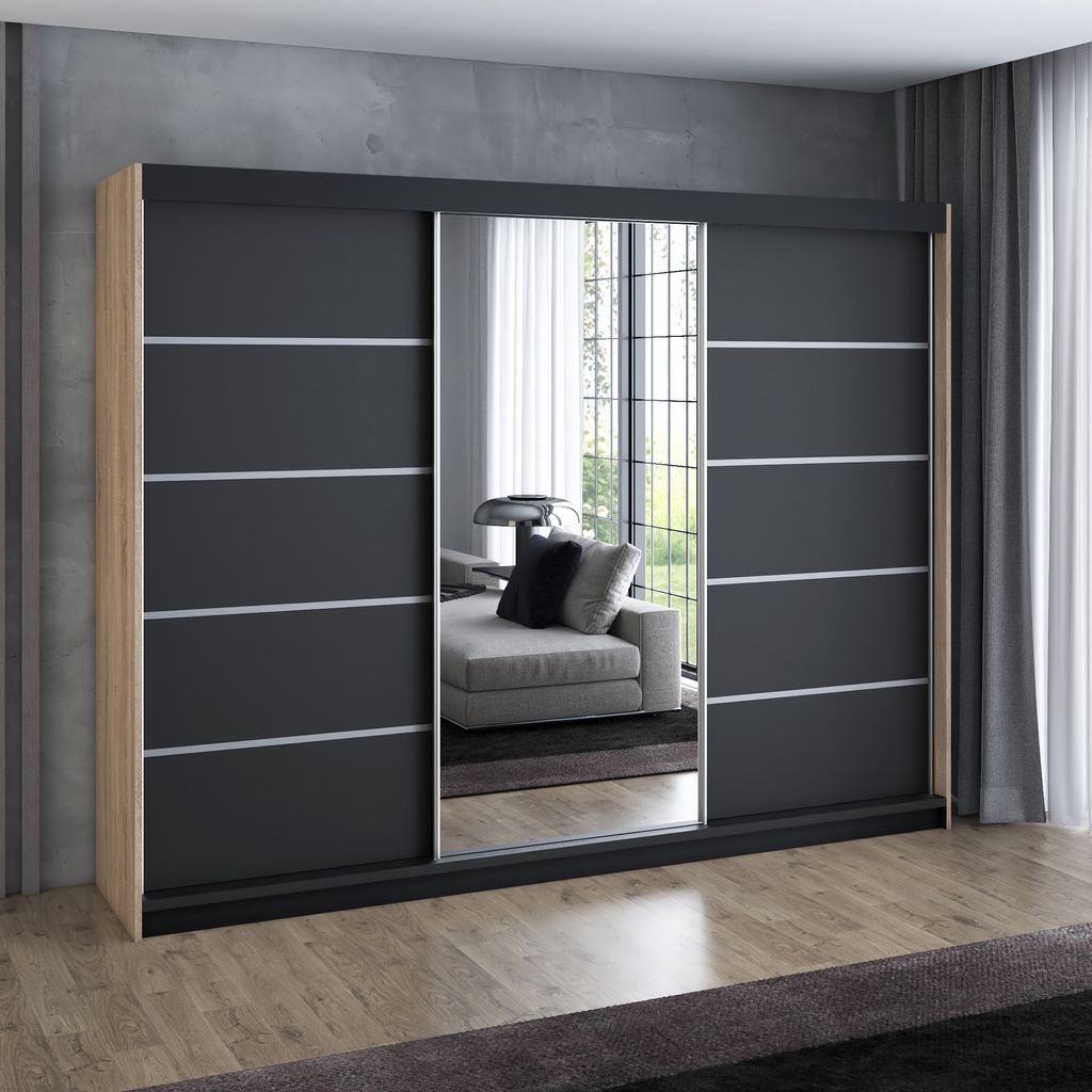 A modern sliding door wardrobe with mirrored panels, set against a concrete wall and wooden floor.