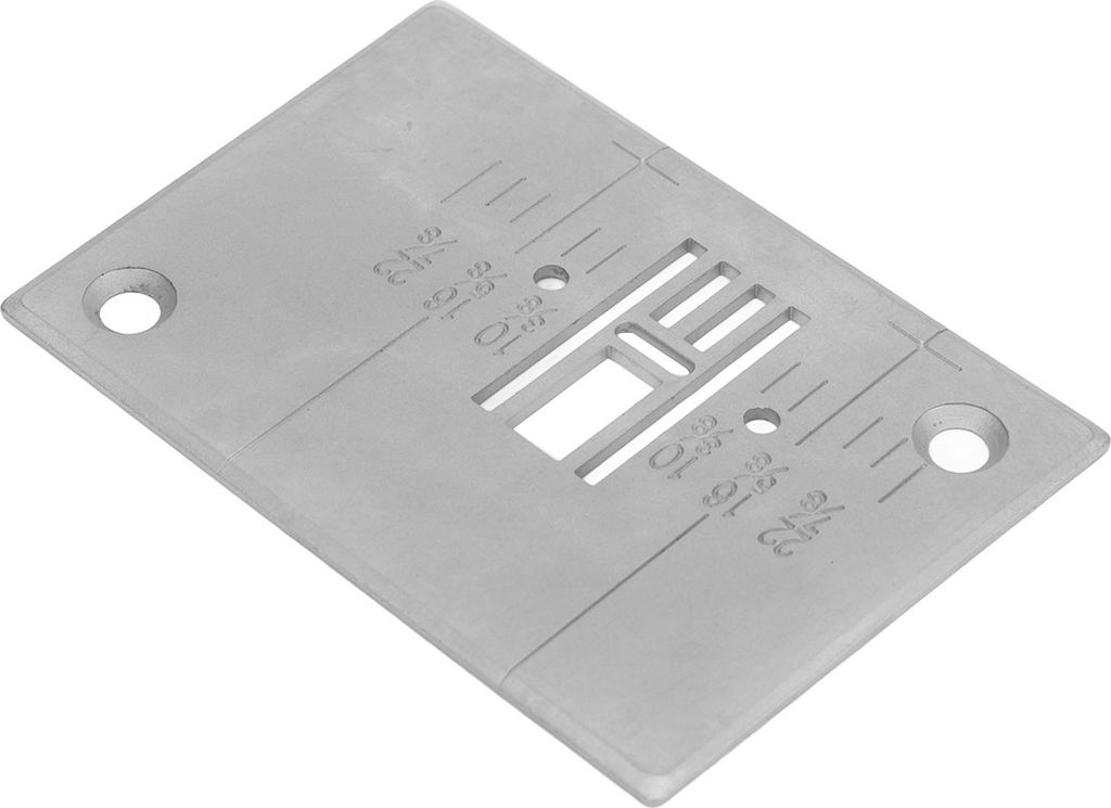 A close-up shot of a sewing machine needle plate with measurement markings.