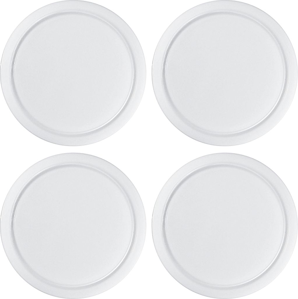 Four white circular cutting boards are arranged in a two-by-two grid on a white background.