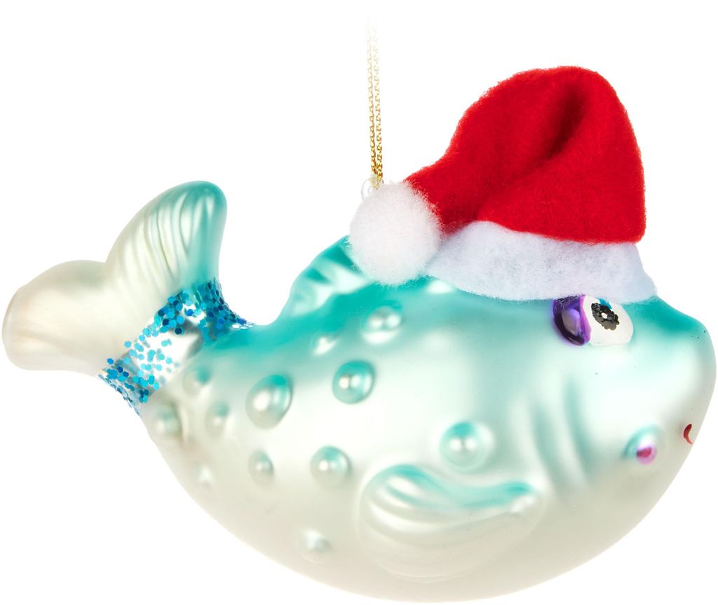 A glass Christmas ornament of a blue fish wearing a Santa hat.
