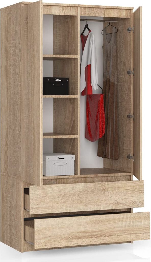 An open wardrobe with clothes hanging inside and shelves with boxes.