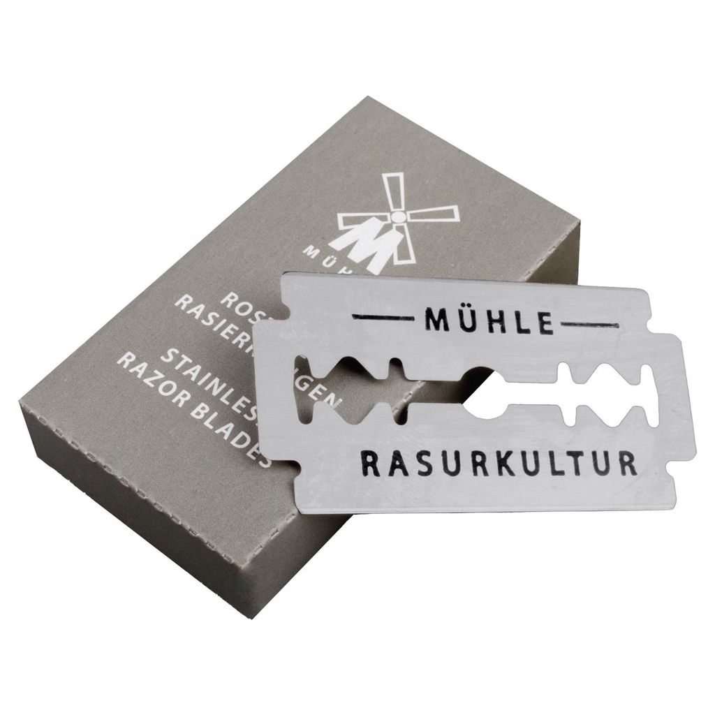 A razor blade and its packaging are shown against a white background.