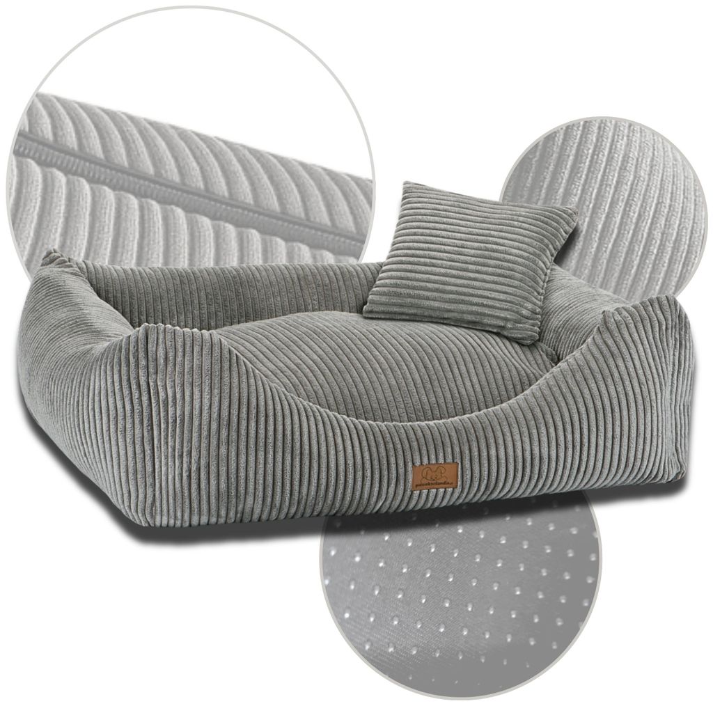 A grey corduroy dog bed with a small pillow, shown from a slightly elevated angle against a white background. Close-up insets highlight the fabric texture and the non-slip bottom.