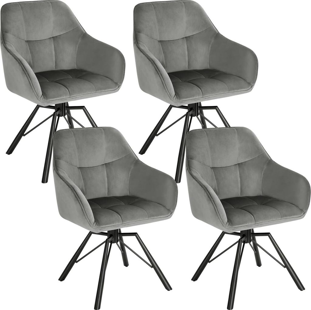 Four dark gray velvet dining chairs with black metal legs are arranged in a grid formation against a white background.
