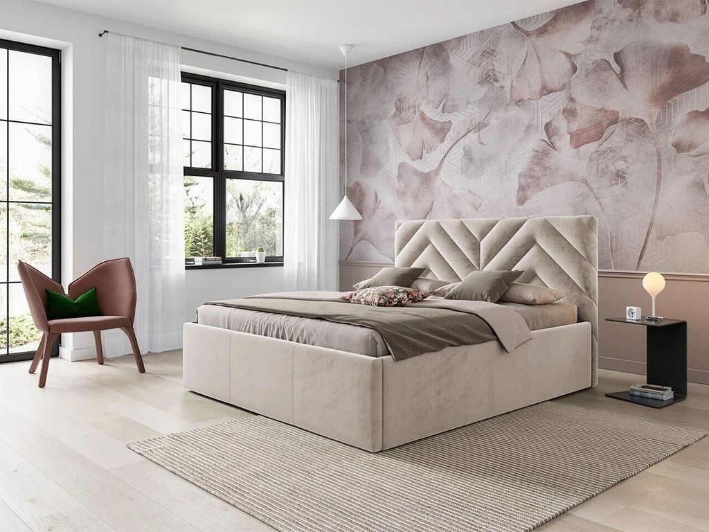 A bedroom scene with a bed, chair, and decorative wallpaper.