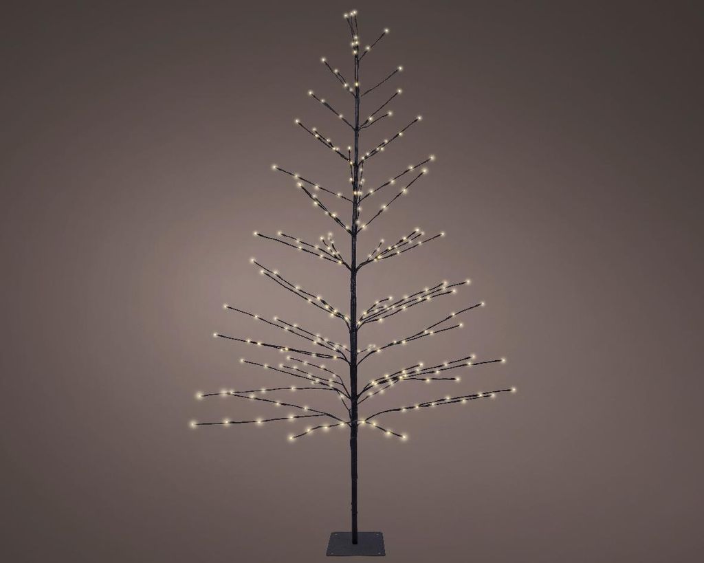 A lit metal Christmas tree with white lights against a plain background.