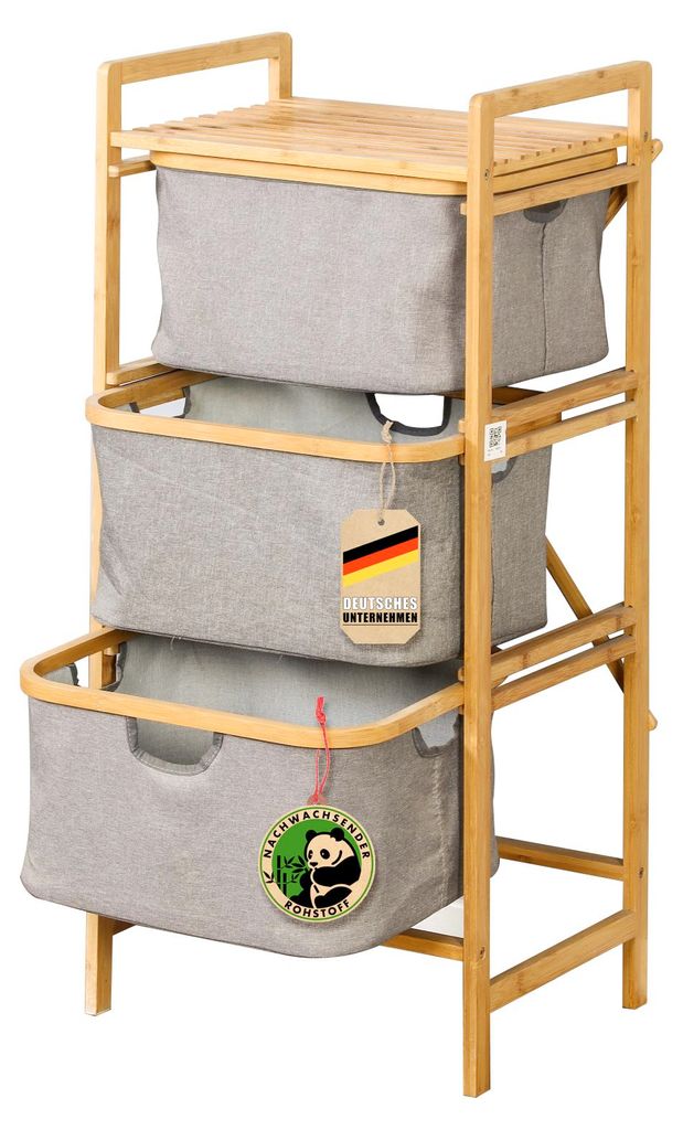 A three-tiered bamboo laundry sorter with gray fabric bins.
