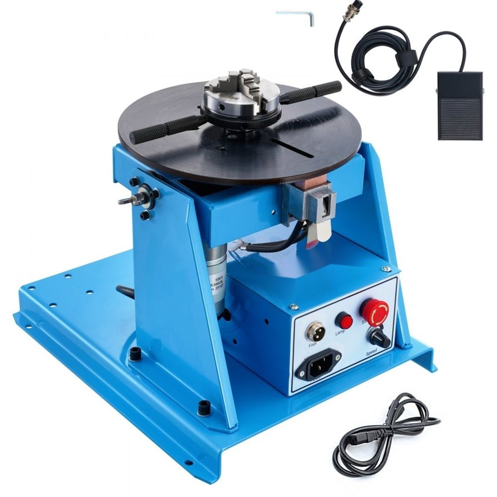 A blue welding positioner with a chuck and a foot pedal on a white background.
