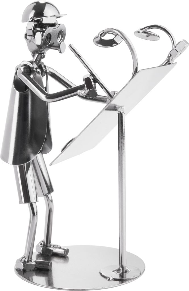 A metallic figurine of an architect standing at a drafting table with lights.