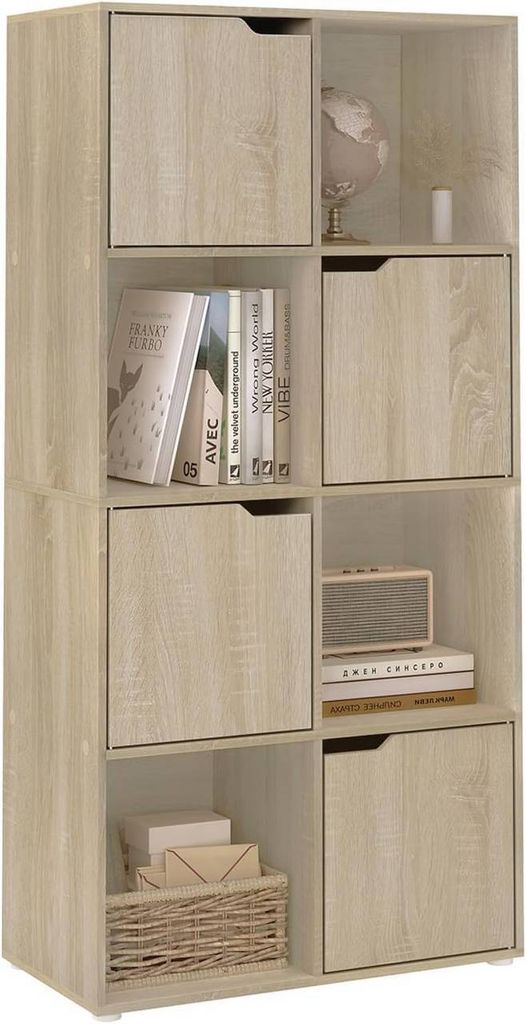 A tall, narrow bookshelf with eight compartments and four doors, made of light oak-colored material, is shown against a white background.