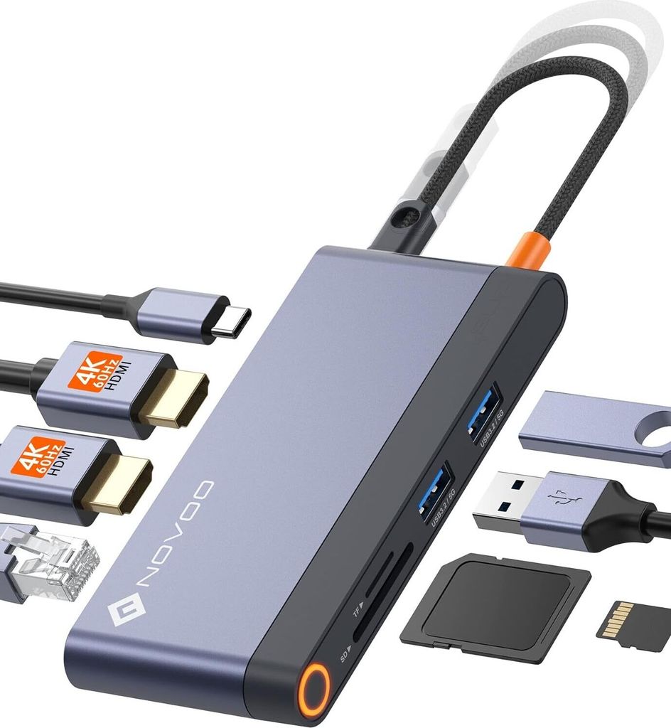 A product shot of a USB-C docking station with various cables and memory cards arranged around it on a white background.