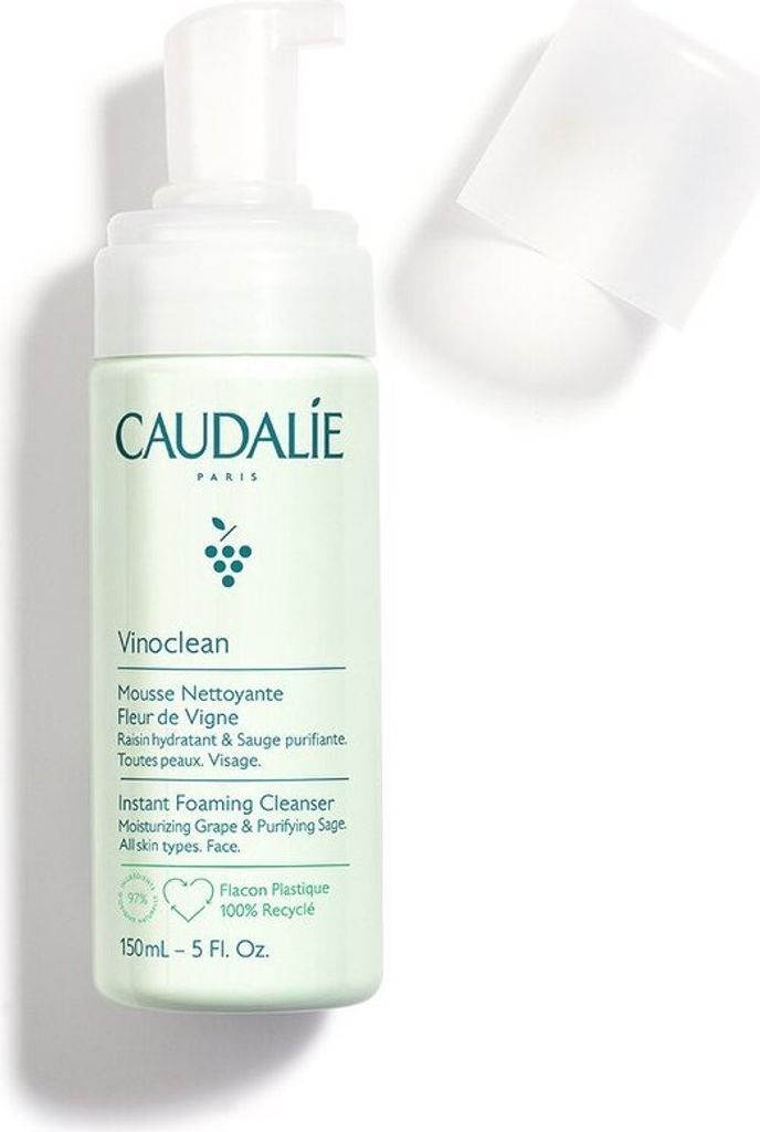 A bottle of Caudalie Vinoclean Instant Foaming Cleanser on a white background with the cap off.