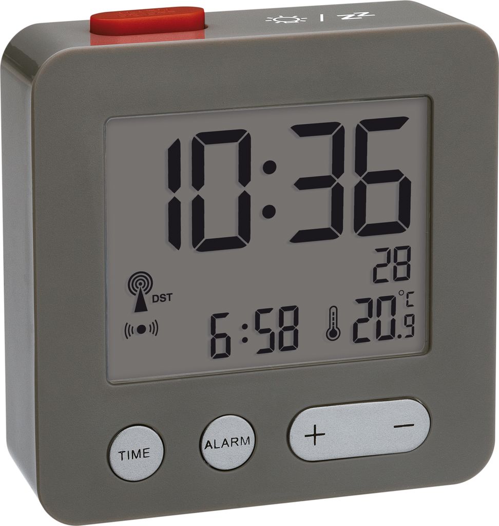 A digital alarm clock with a red button on top, displaying time, date, and temperature.