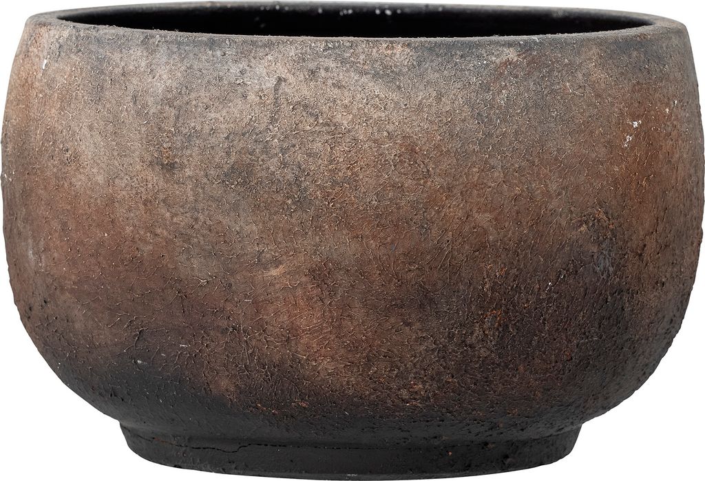 A close-up view of a round, textured planter pot with a dark, earthy color palette.