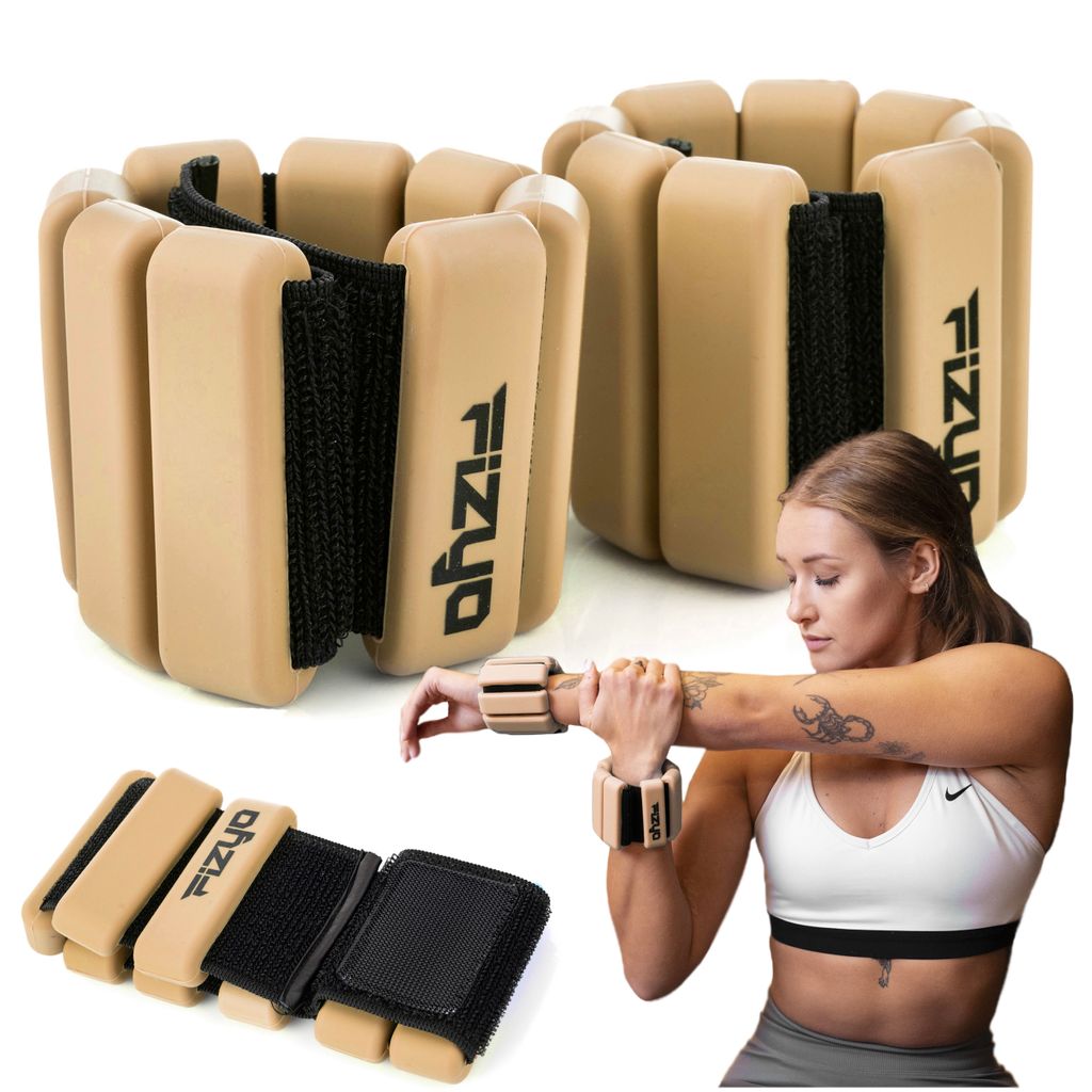 A woman is stretching her arm while wearing wrist weights. Two pairs of wrist weights are also shown in the foreground.
