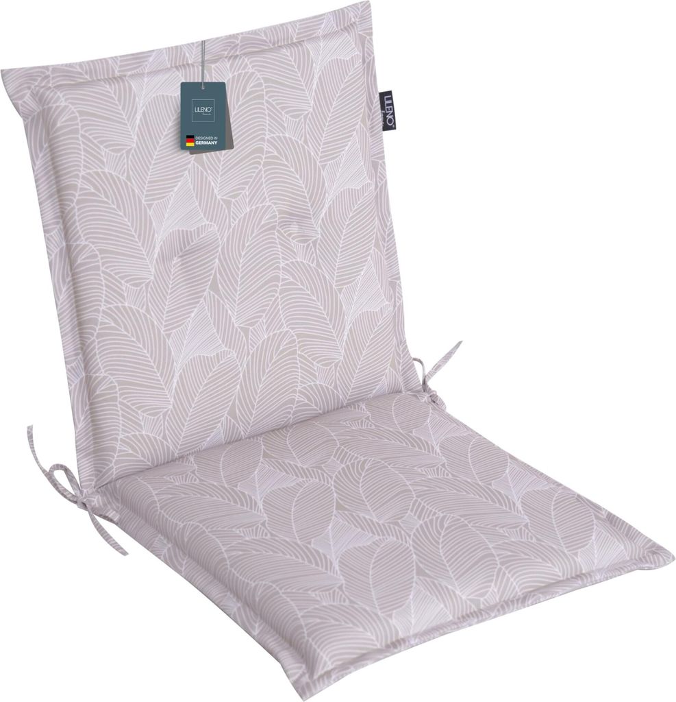 A chair cushion with a leaf pattern.