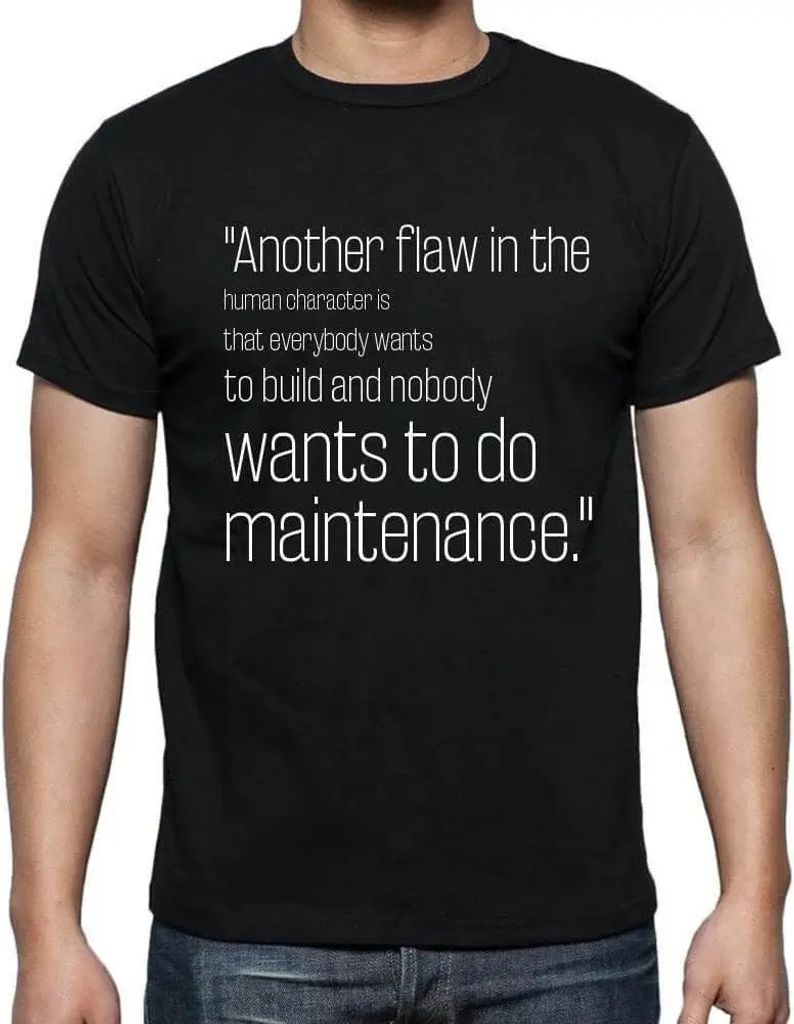 Herren Grafik T-Shirt Eine weitere Schwäche des menschlichen Charakters besteht darin dass alle bauen wollen und niemand die Instandhaltung übern...