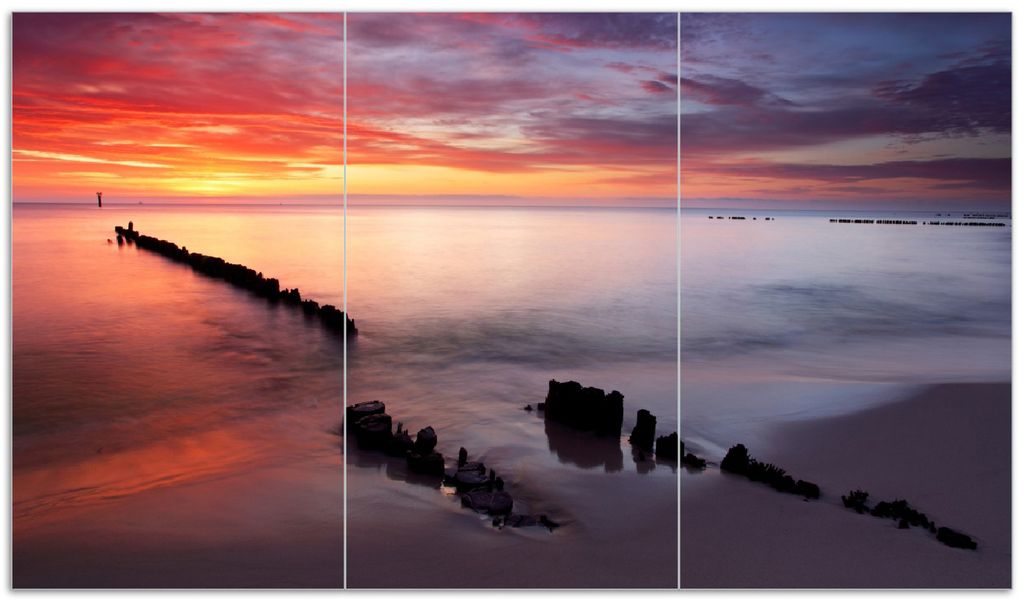 Wallario Herdabdeckplatte aus Glas, Größe 90 x 52 cm 3-teilig, Motiv Sandstrand im Sonnenuntergang - Roter Himmel