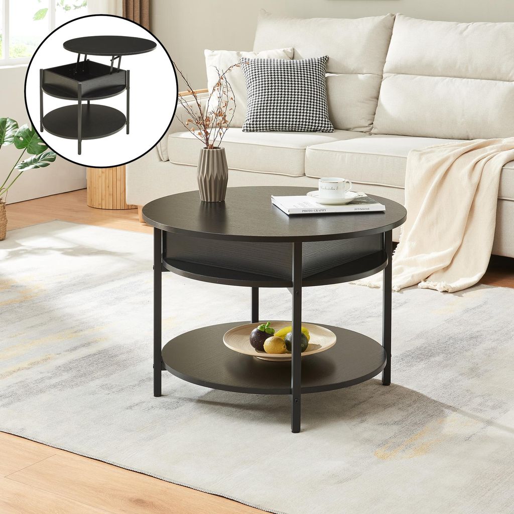 A round coffee table with a lift-top is shown in a living room setting, next to a sofa.