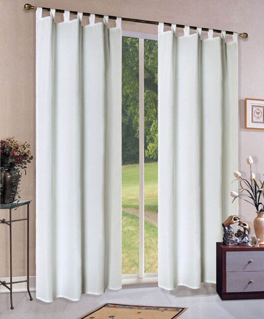 A window with white curtains and a view of greenery outside.