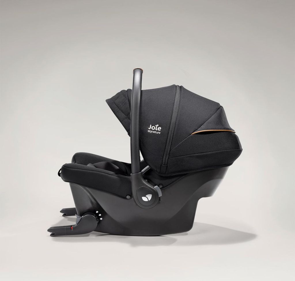 A black Joie Signature Sprint baby car seat is shown in profile against a light gray background.