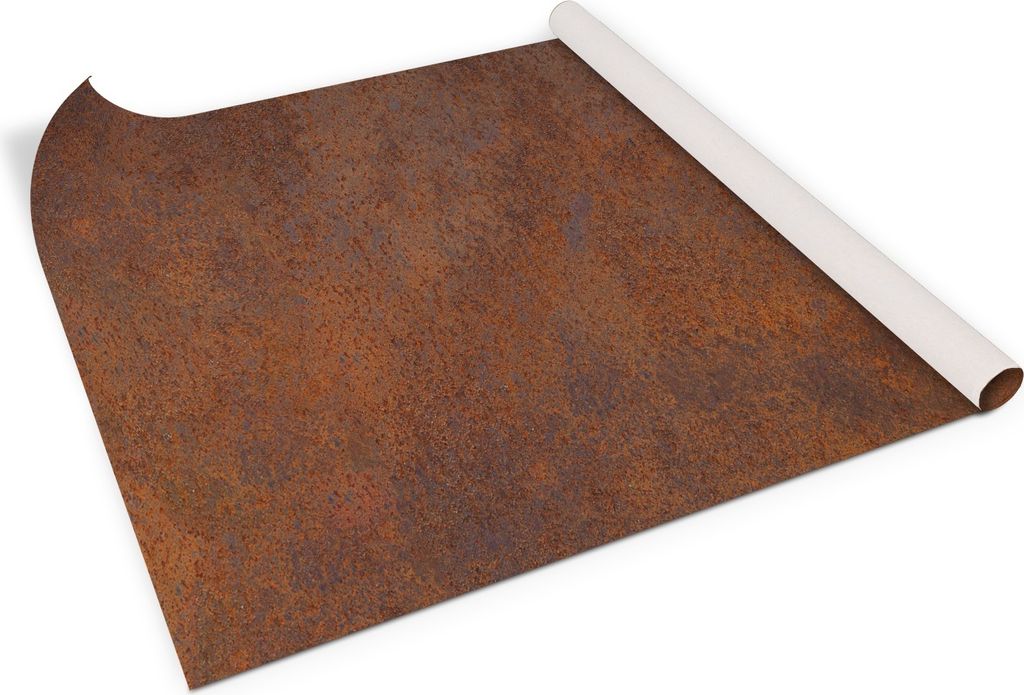 A roll of self-adhesive furniture film with a rusty metal texture is partially unrolled on a white surface.