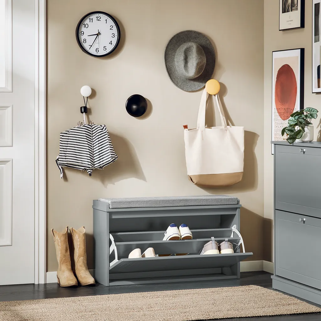 Commode à chaussures grise avec coussin d'assise et rangement compact