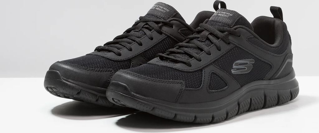A pair of black Skechers sneakers on a white background.