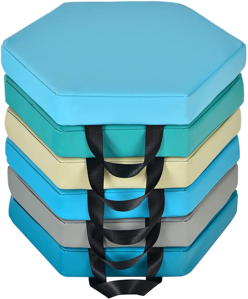 A stack of hexagonal floor cushions with handles.