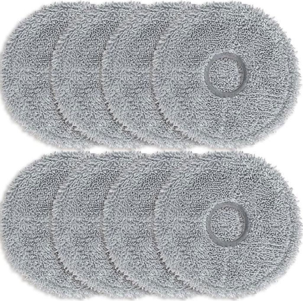 A top-down view of two rows of round, gray cleaning pads, likely for a robot vacuum cleaner.