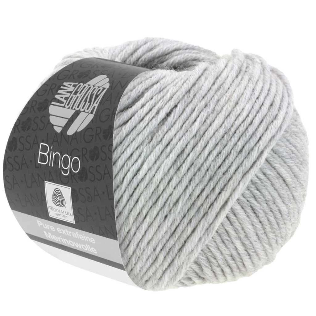 A ball of light gray yarn with a label.