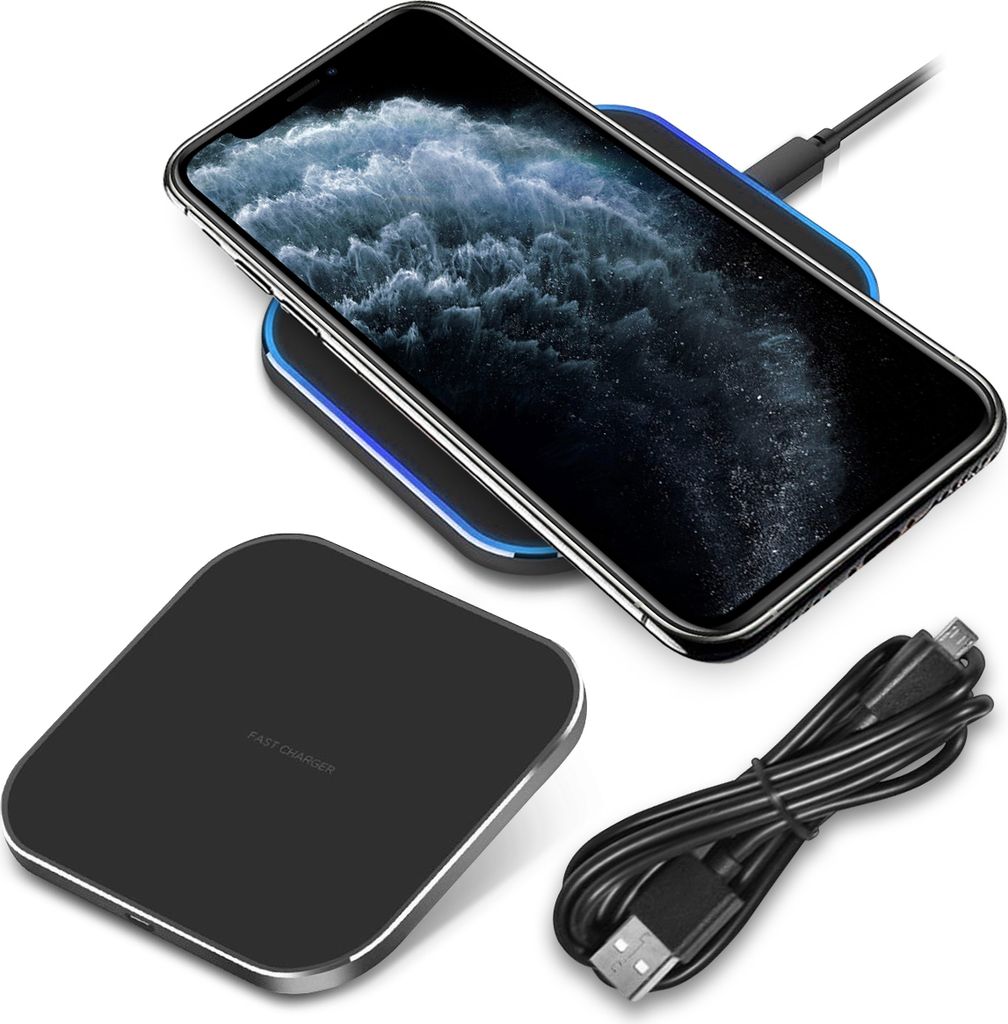 A smartphone is charging wirelessly on a charging pad, with a USB cable nearby.