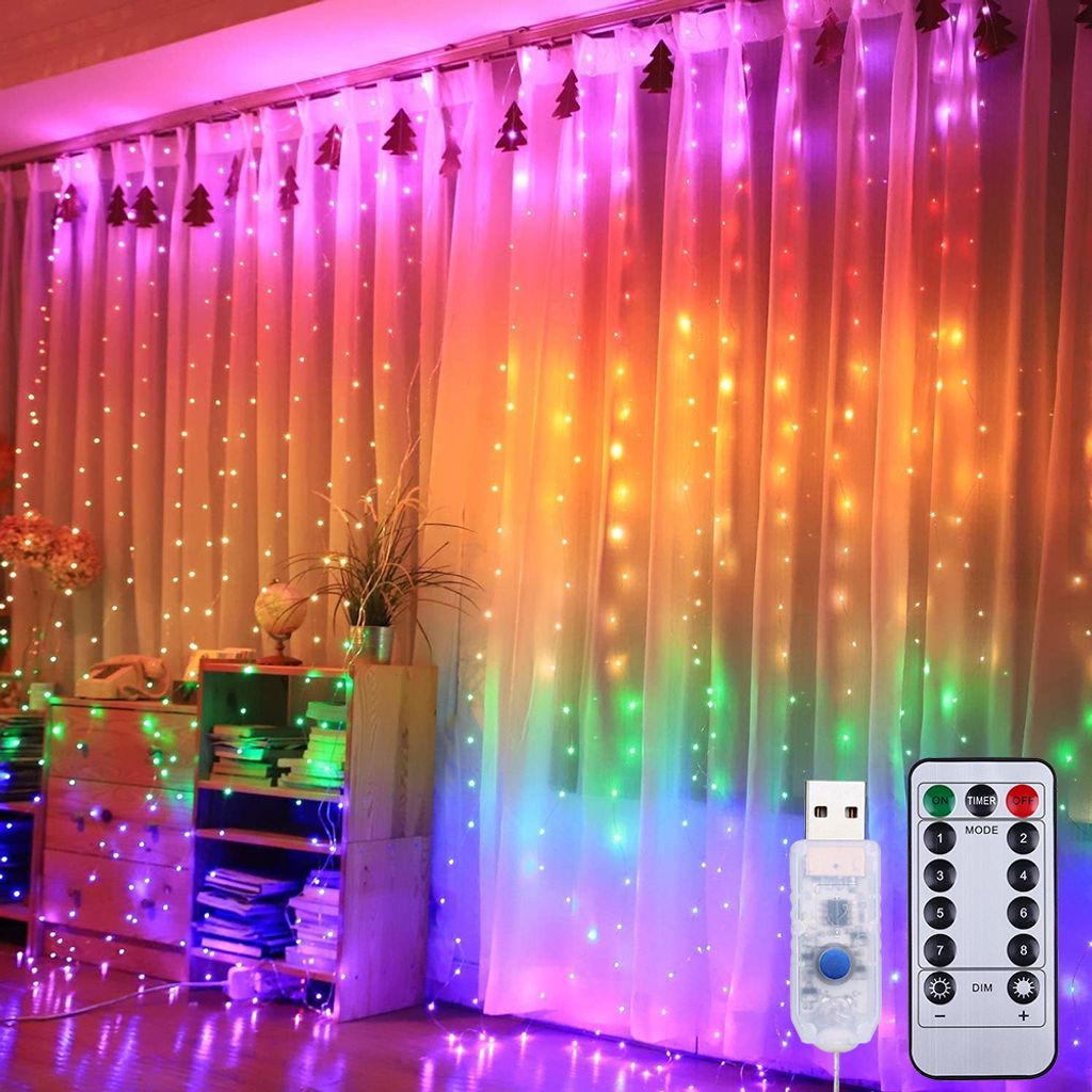A room decorated with colorful LED curtain lights, furniture, and plants.